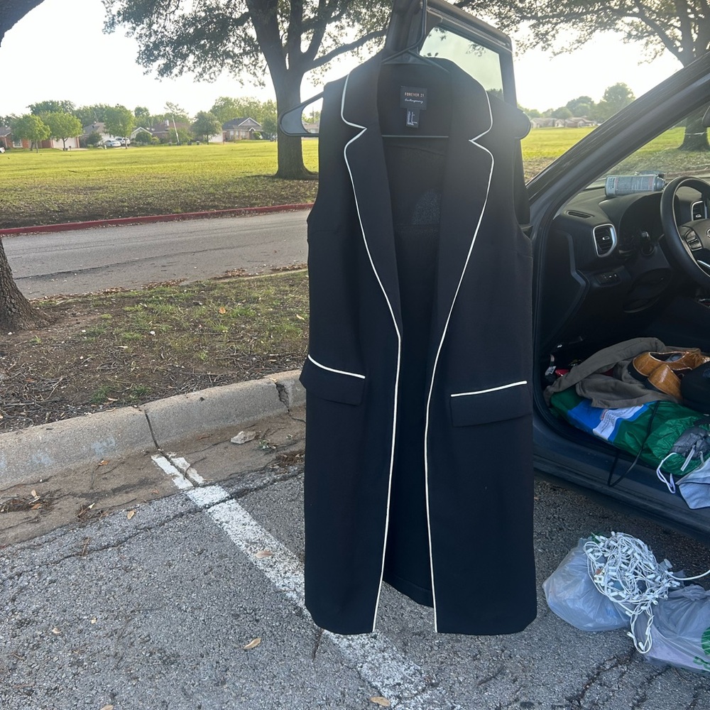 Black Sleeveless Vest with White Trim